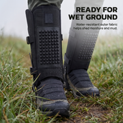 Water resistant snake gaiters shedding moisture and mud in wet grass